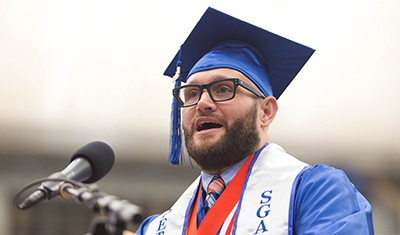 AN SPC graduate speaking at a graduation ceremony