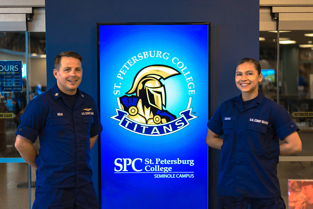 two U.S. Coast Guard members posing at the SPC Seminole Campus