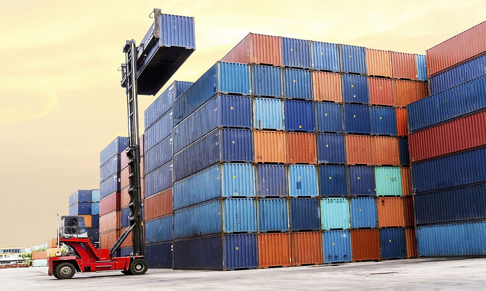 stack of rail cars and crane