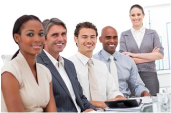 A corporate team sitting at a conference table.