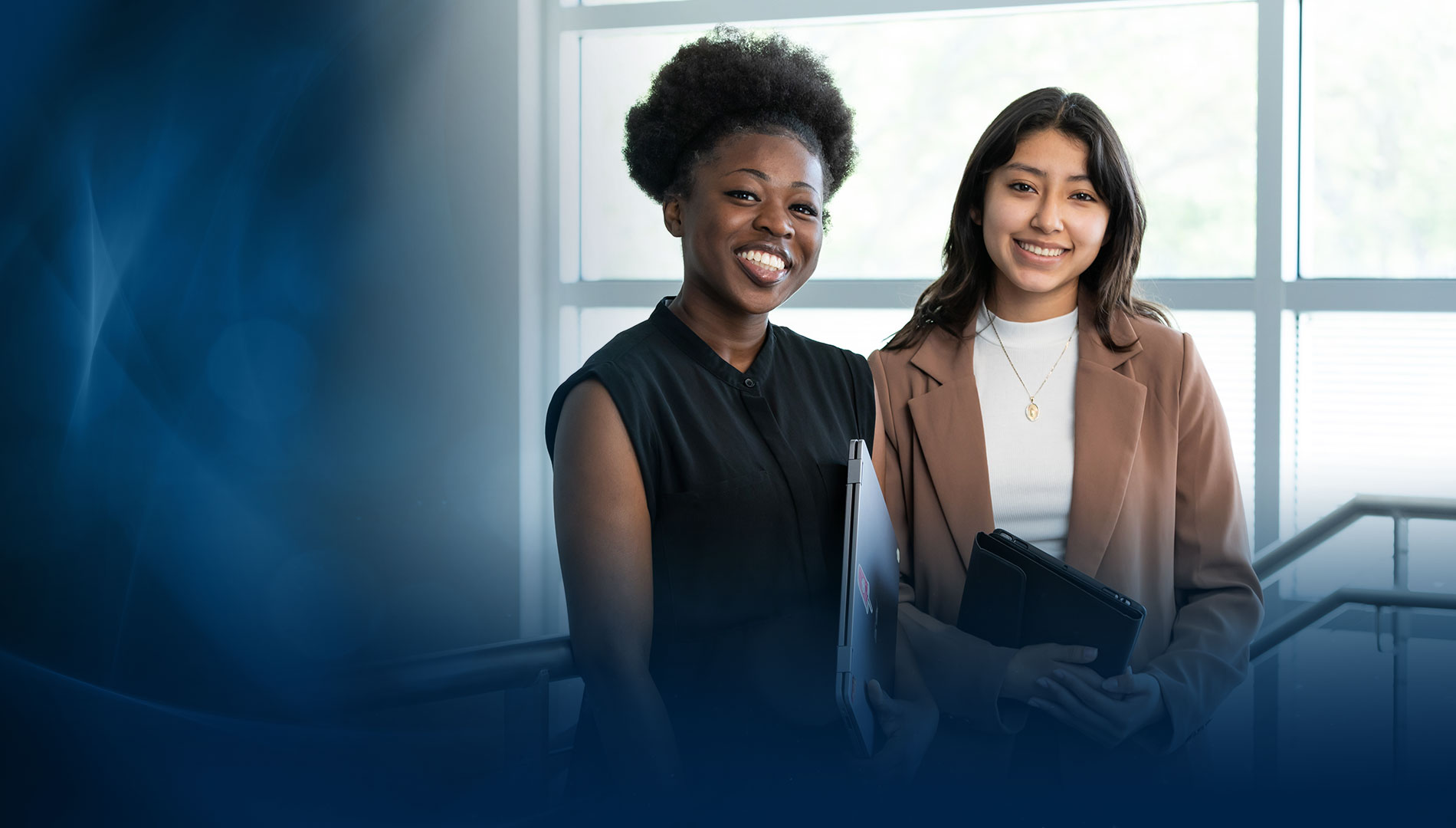 two female SPC students smiling