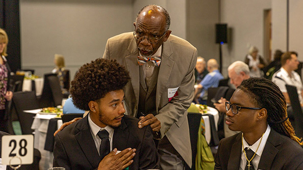 dr jospeh smiley with two students