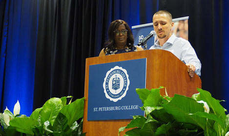 Dr. Williams and a donor at the podium