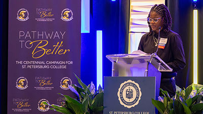St. Petersburg College student and basketball player Celine Forine speaking at donors and scholars luncheon