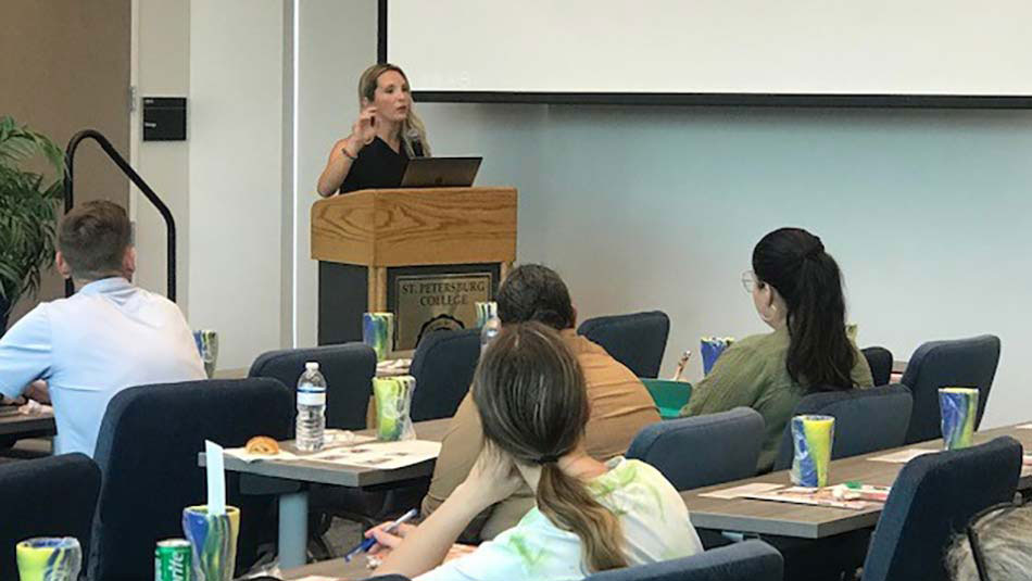 Madison MacGeorge speaks from the podium at the First-Time Home Ownership Workshop