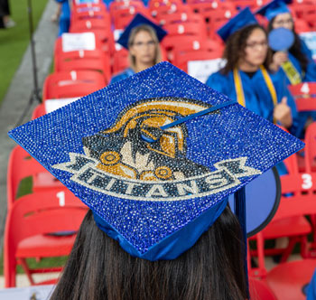 graduation cap decorated with TItan logo
