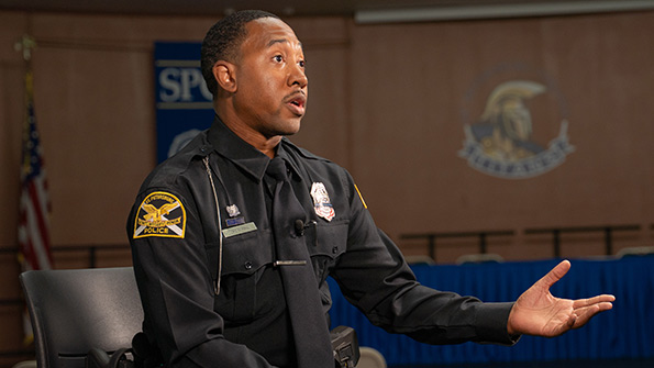 police officer with his arms outstretched