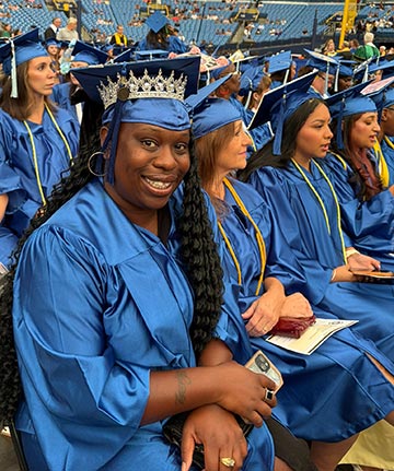 Shanita Whiting sits with her peers at commencement