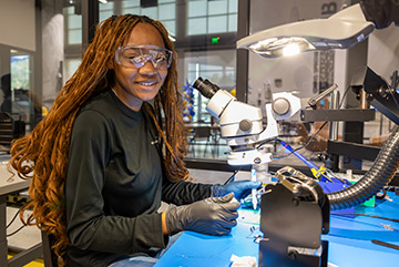Mariah O'Neal working at a soldering station
