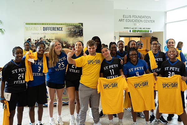group of SPC students in yellow shirts celebrating at SPC Day 2025
