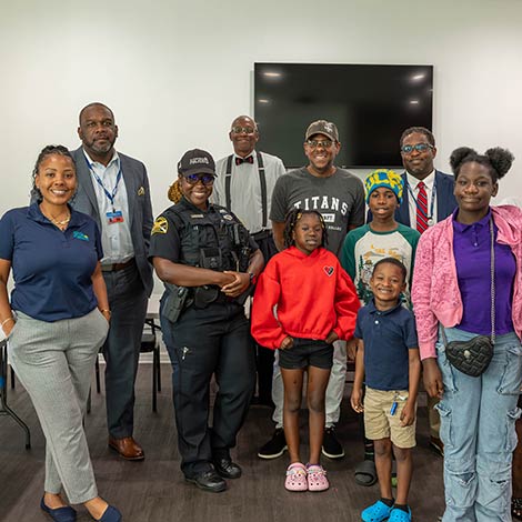 group of students with officials from St. Petersburg Housing Authority