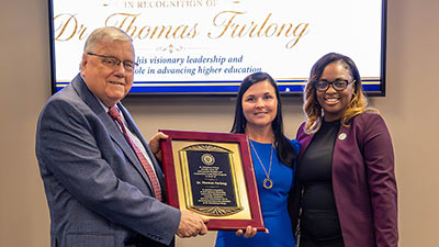 portrait of Dr. Thomas Furlong, Heather Duncan and Rebecca Brown