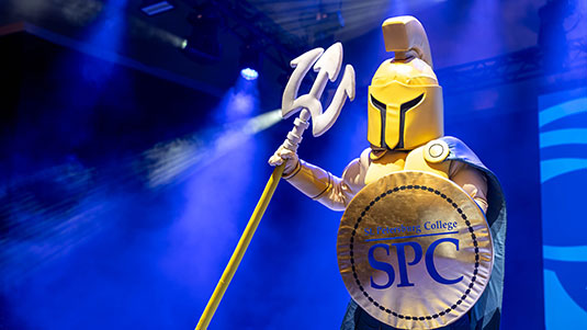 Titus the Titan posing in the smoke machine at an SPC sporting event