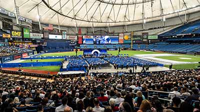 group of graduates and attendees at SPC commencement at Tropicana Field