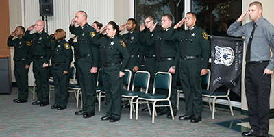 group of police officers saluting their superior officers