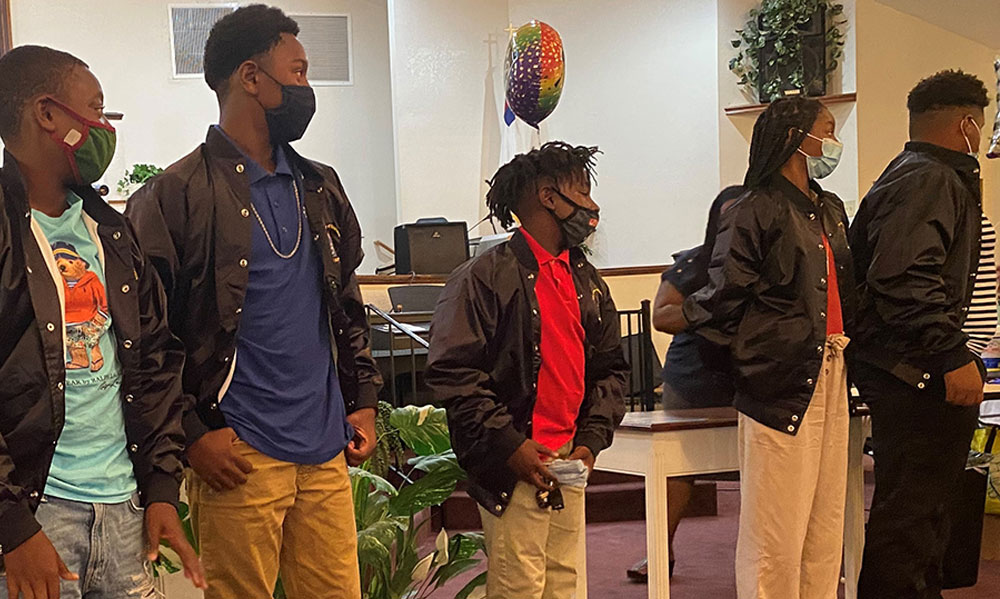 a group of young black men lined up for an introduction