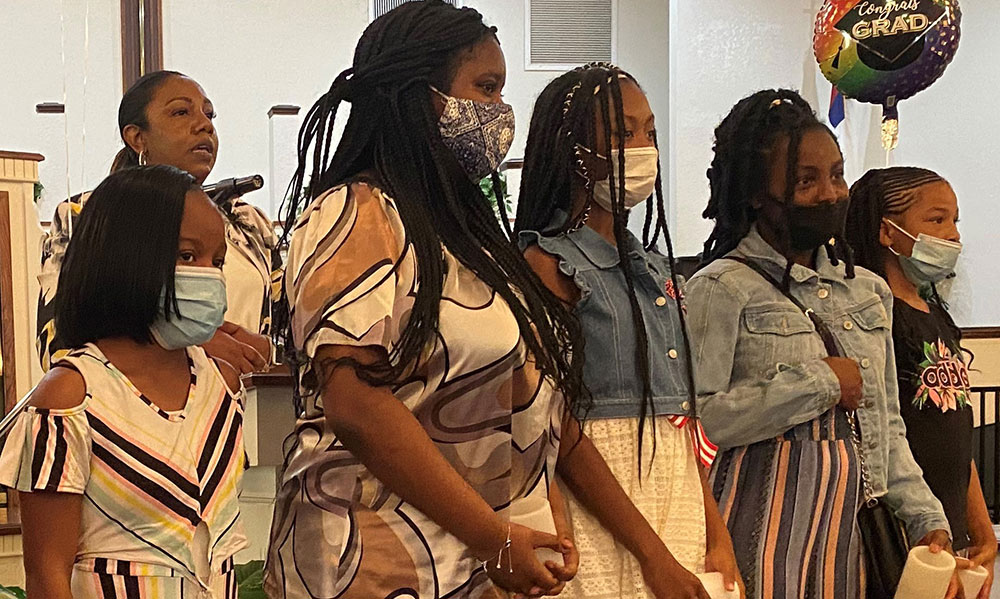 a group of black women in line for NAS induction