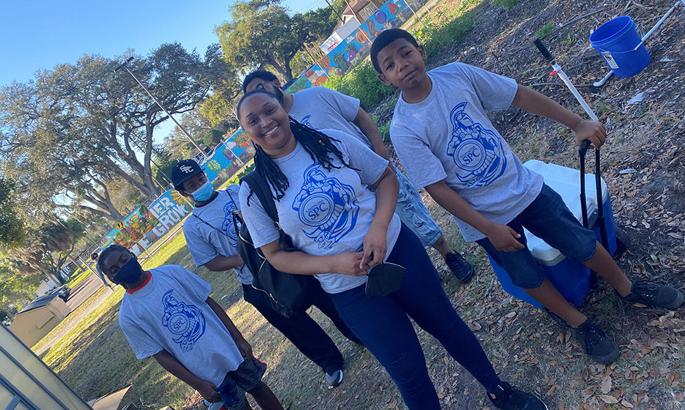 group of students wearing SPC shirts at youth farm