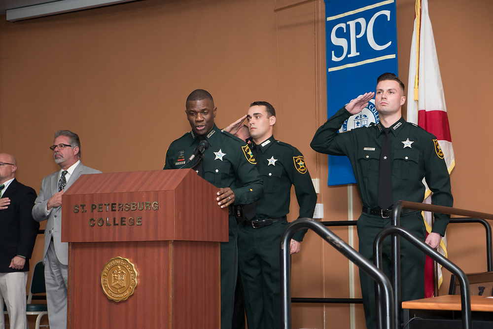 Sherriff's deputies speaking at an SPC event