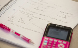 image of a calculator and a notepad