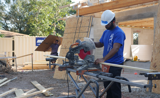 SPC volunteer working at a home construction site