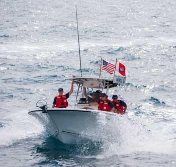 underwater blue image of scuba diver with fish