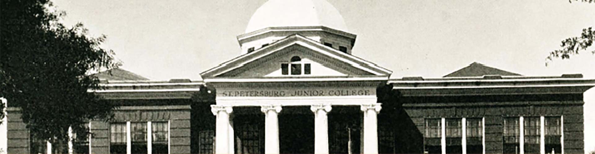 Black and white photo of Saint Petersburg Junior College, showing the columns and dome from the front of the building.
