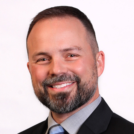 portrat of jacob wortock wearing a suit and tie