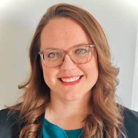 portrait of jennier gross wearing a turquoise top and blue jacket
