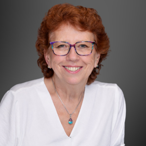 portrait of Mary Berg wearing a white button down shirt