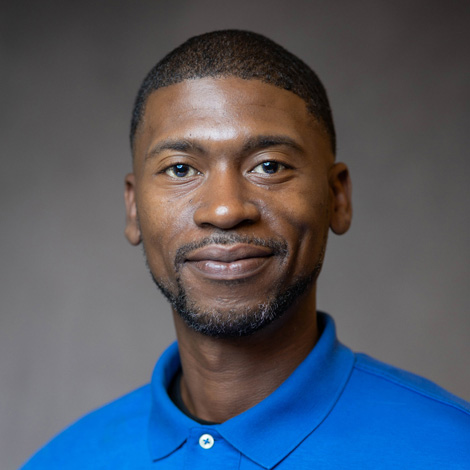 portrait of Nikia Smith wearing a blue polo shirt