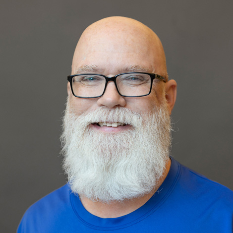 portrait of scott cooprt wearing a blue t shirt