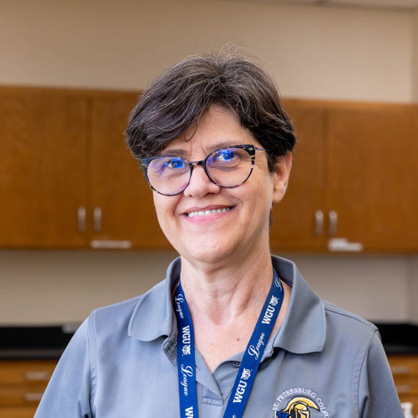 portrait of Teresa Gaskill wearing a gray SPC polo and lanyard