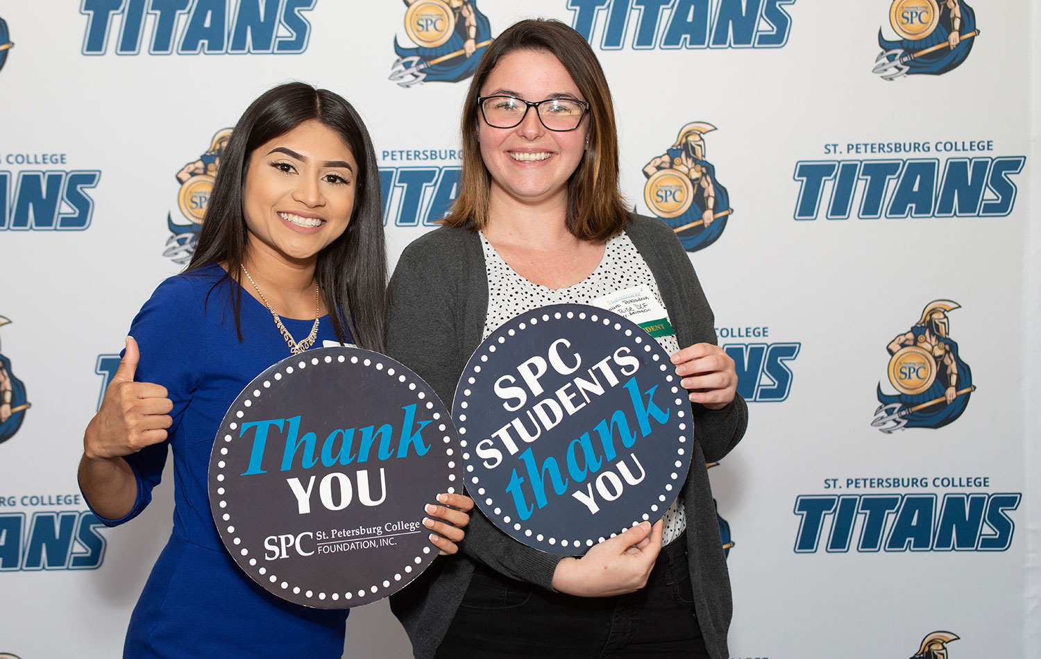 SPC Foundation staff poses with thank you signs
