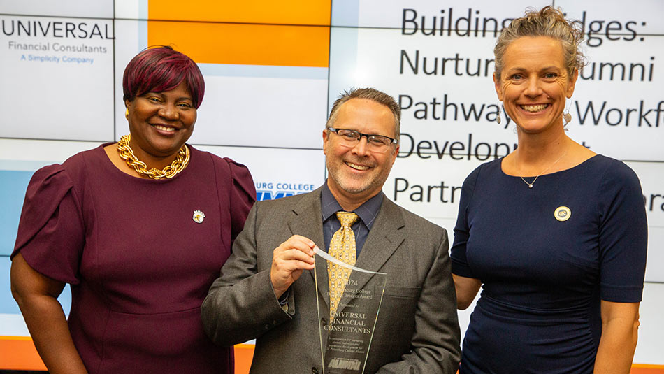 Theresa McFarland, SPC Foundation Executive Director of Annual Giving & Alumni Engagement Program, and Sara Sabourin, SPC Business Relationship Manager, present the Building Bridges: Nurturing Alumni Pathways and Workforce Development Award to Jeff Mowry, Senior Financial Designer for Universal Financial Consultants.