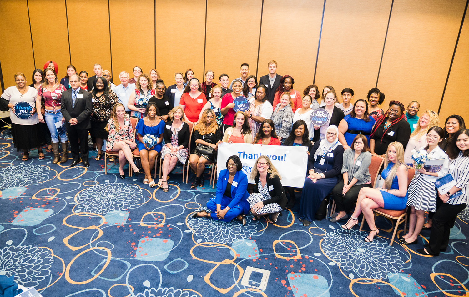 large group of people celebating 20th Annual Scholarship Luncheon