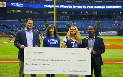 people attending a check presentation