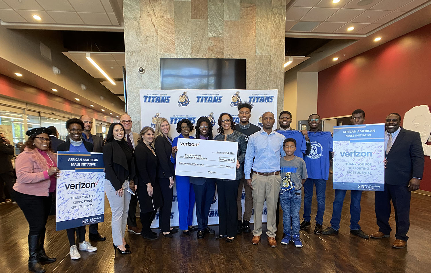 group of people celebrating contribution from Verizon