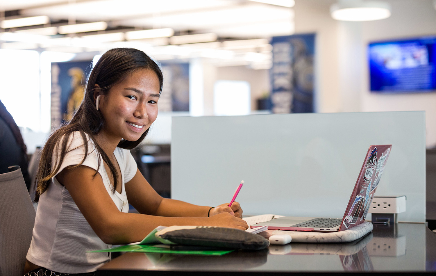 student with laptop at desk