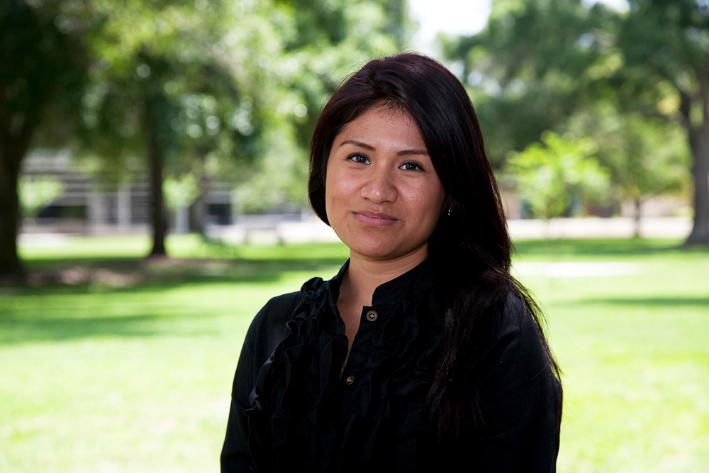 SPC student female student wearing a black suit with folded arms