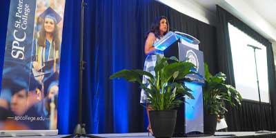 woman at a podium giving a speech