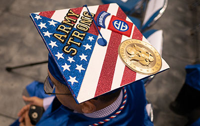 graduation cap with veterans logos