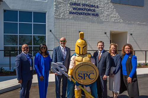 dignitaries standing in front of the Chris Sprowls Workforce Innovation Hub at the Tarpon Springs Campus