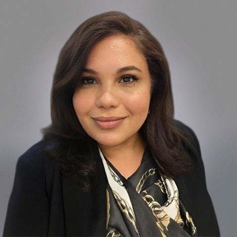 A portrait of Melissa Gonzalez, wearing a black blazer 