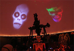 promo image for Legends of the Fall depicting the Planetarium interior decorated for Halloween