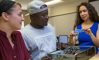 SPC instructor demostrating to students in a technology lab