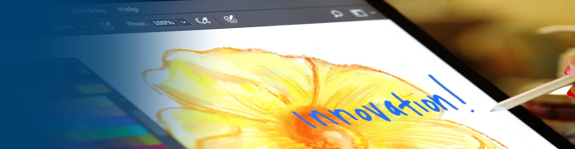 A hand drawing the word Innovation on a computer screen over the drawing of a yellow flower.