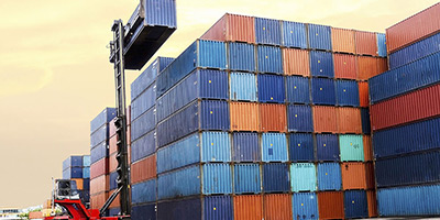 stack of rail cars and crane