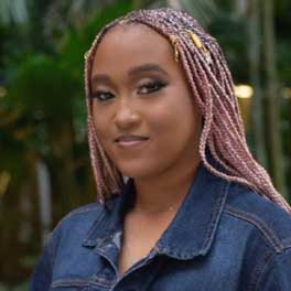 Photo of Kamae Hamilton wearing a denim shirt