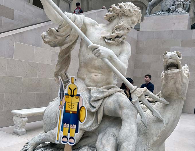 A marble sculpture of Neptune, created by Antoine Coysevox in 1705, on display in Cour Marly in the Richelieu Wing of the Louvre. Flat Titus appearing in the foreground.